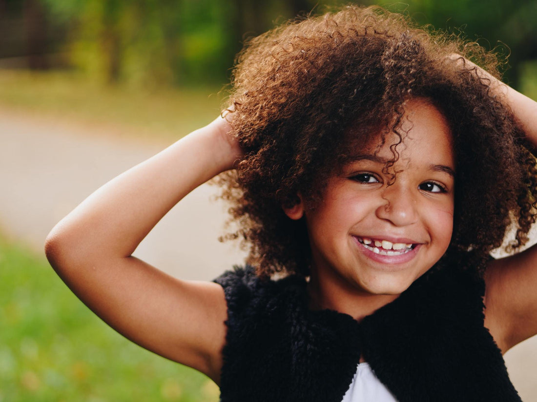 little girl with curly hair "t is for tame"