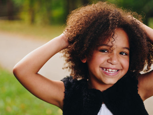 little girl with curly hair "t is for tame"