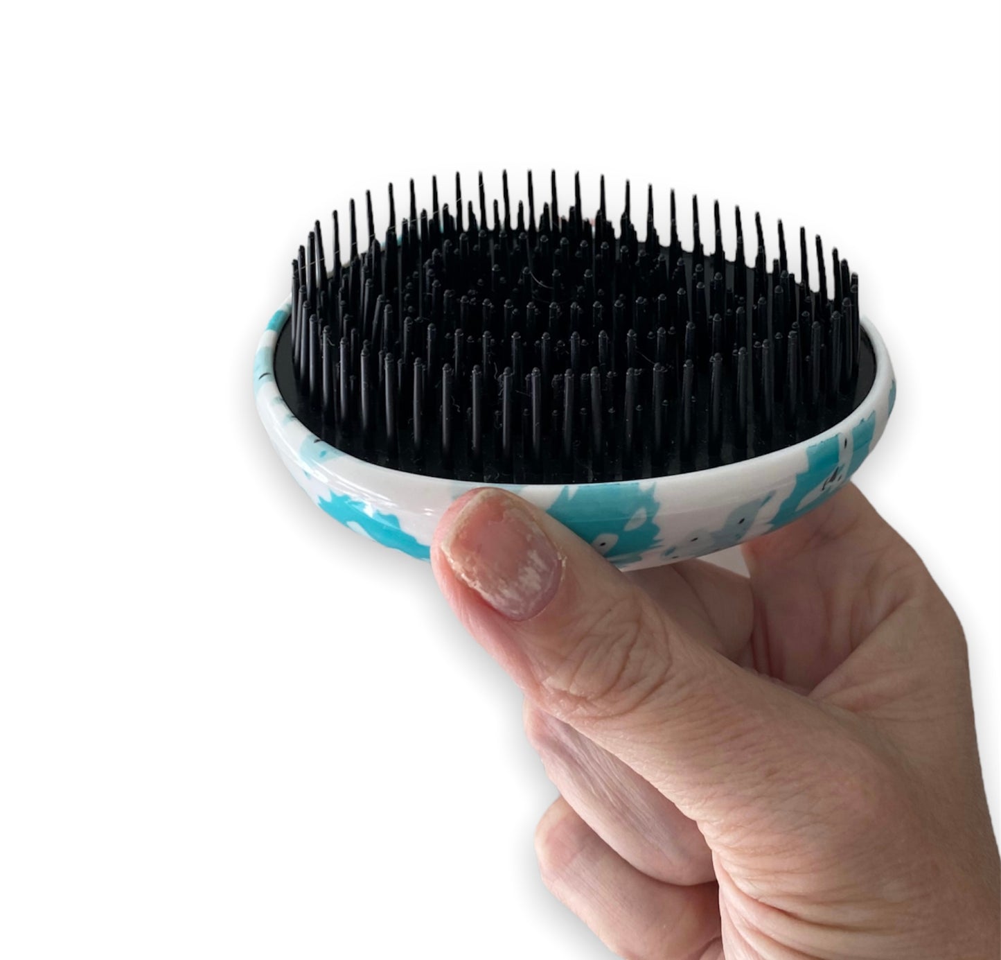 Close-up of kids mini detangling brush